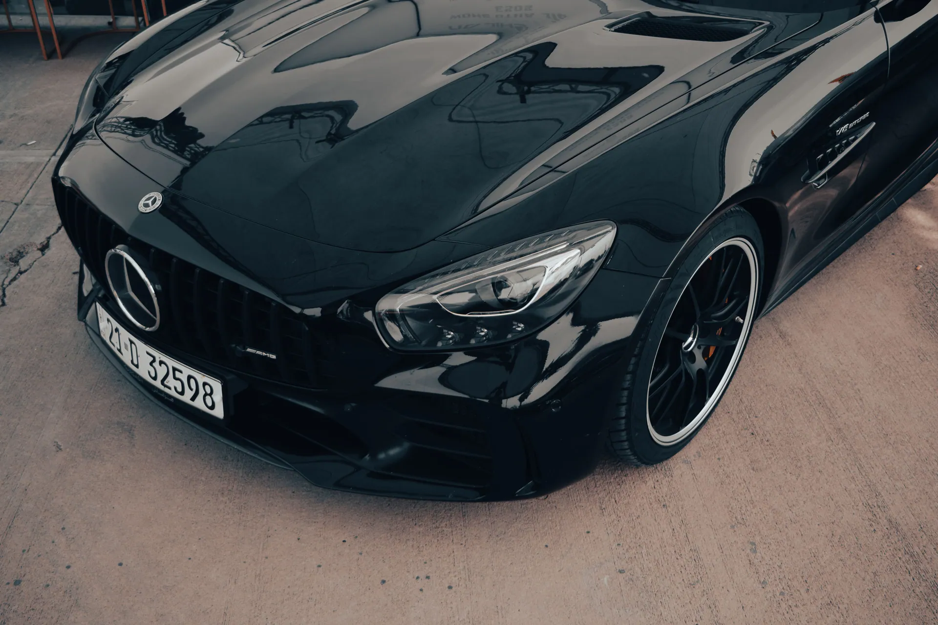 Sleek black Mercedes Benz AMG GT with elegant design and luxury features.