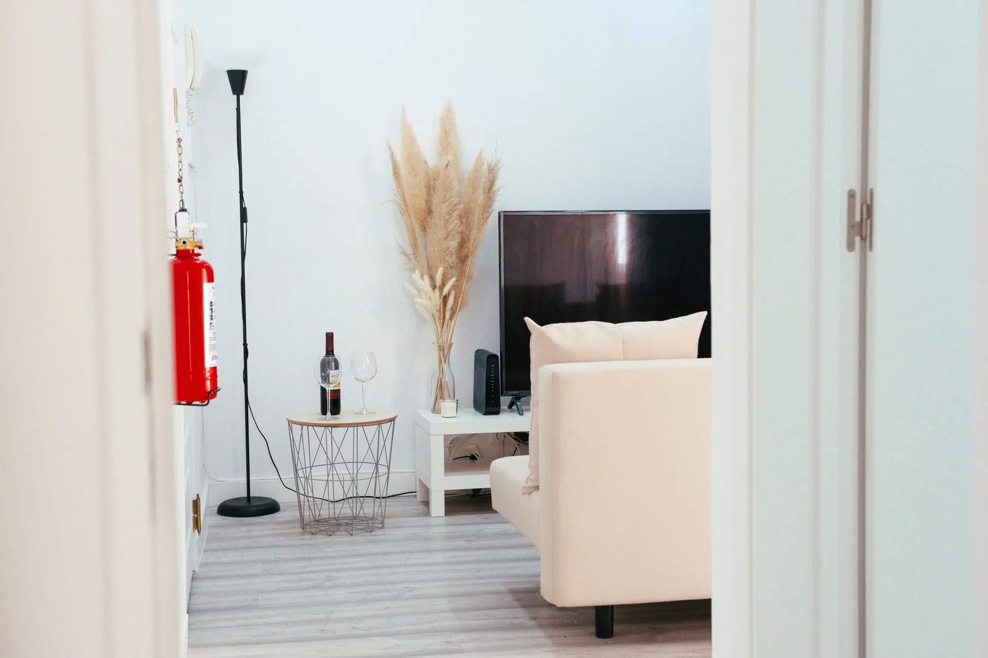 A stylish living room with modern furnishings, TV, and decor accents.
