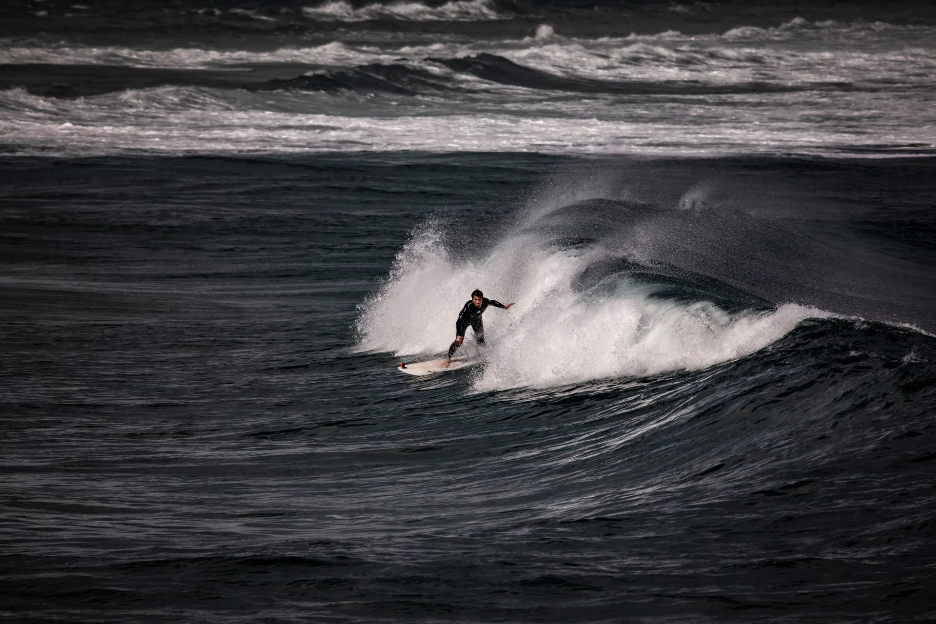 Expert surfer riding powerful waves in Goseong-gun, South Korea.