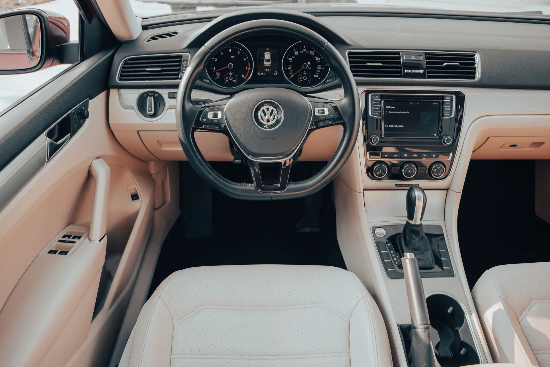 Explore the elegant and modern interior design of a Volkswagen Passat, showcasing the steering wheel and dashboard.