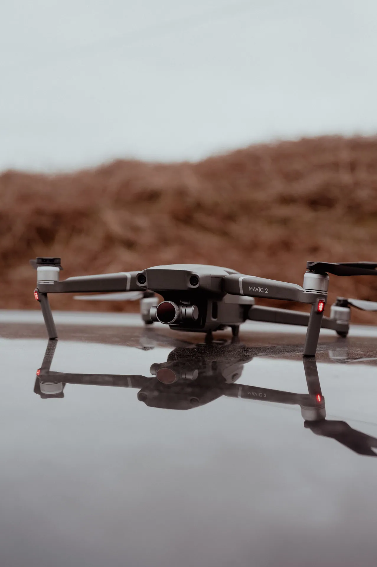 Close-up of a drone on a reflective surface outdoors in Scotland.
