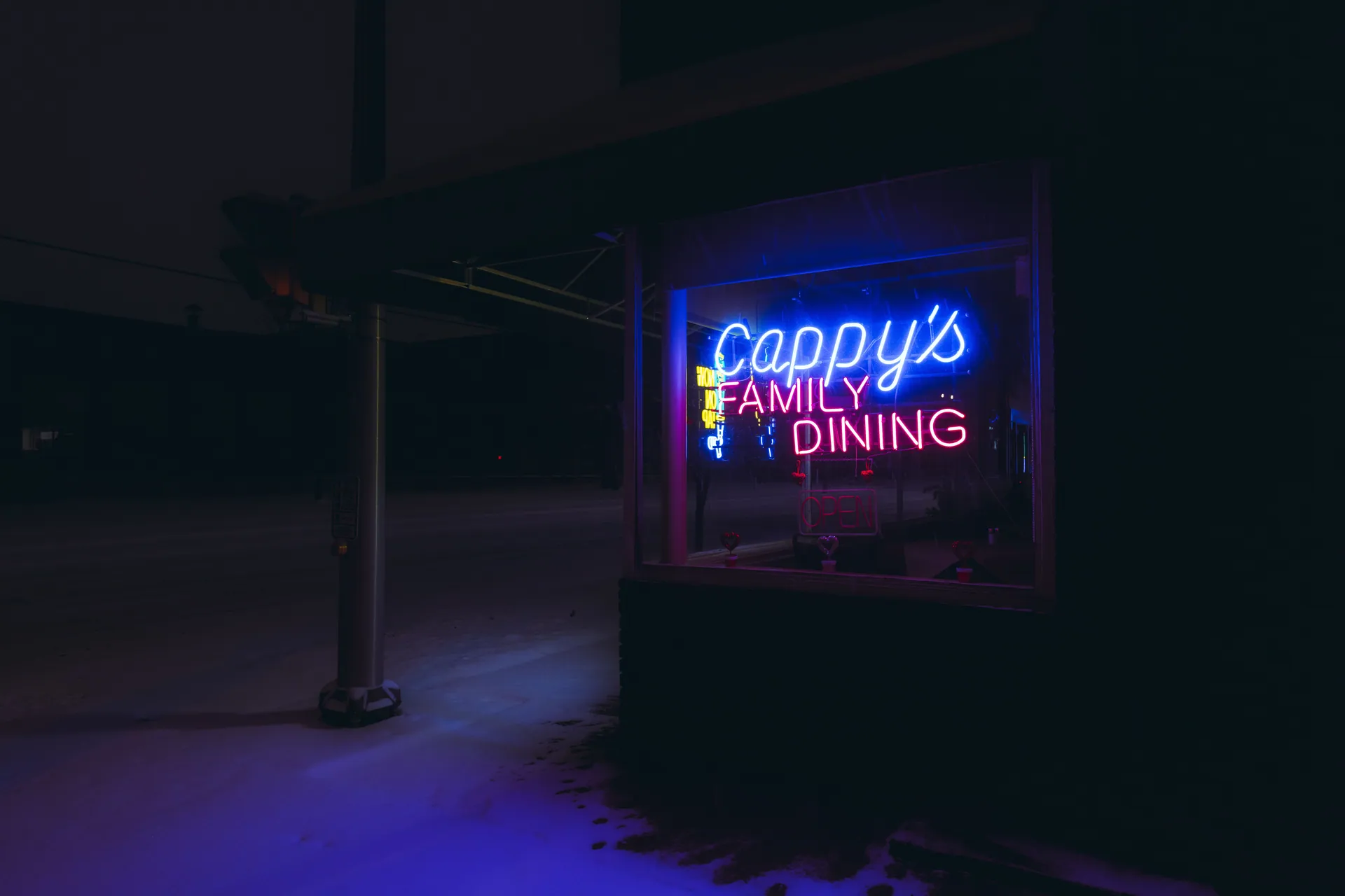 Atmospheric night photo featuring a neon sign outside Cappy's Family Dining in Elkhart, Indiana.