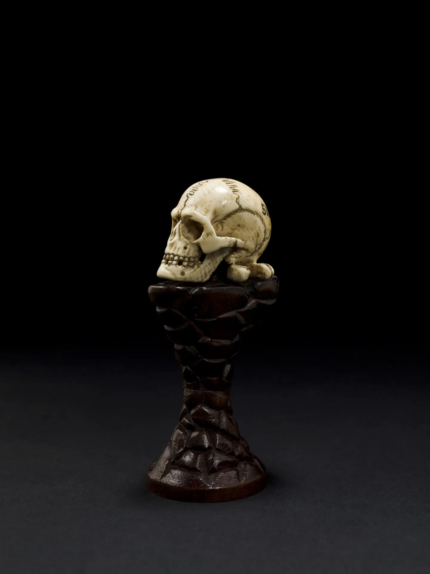 Ivory model of a skull on a wooden pedestal, Europe Wellcome L0057531