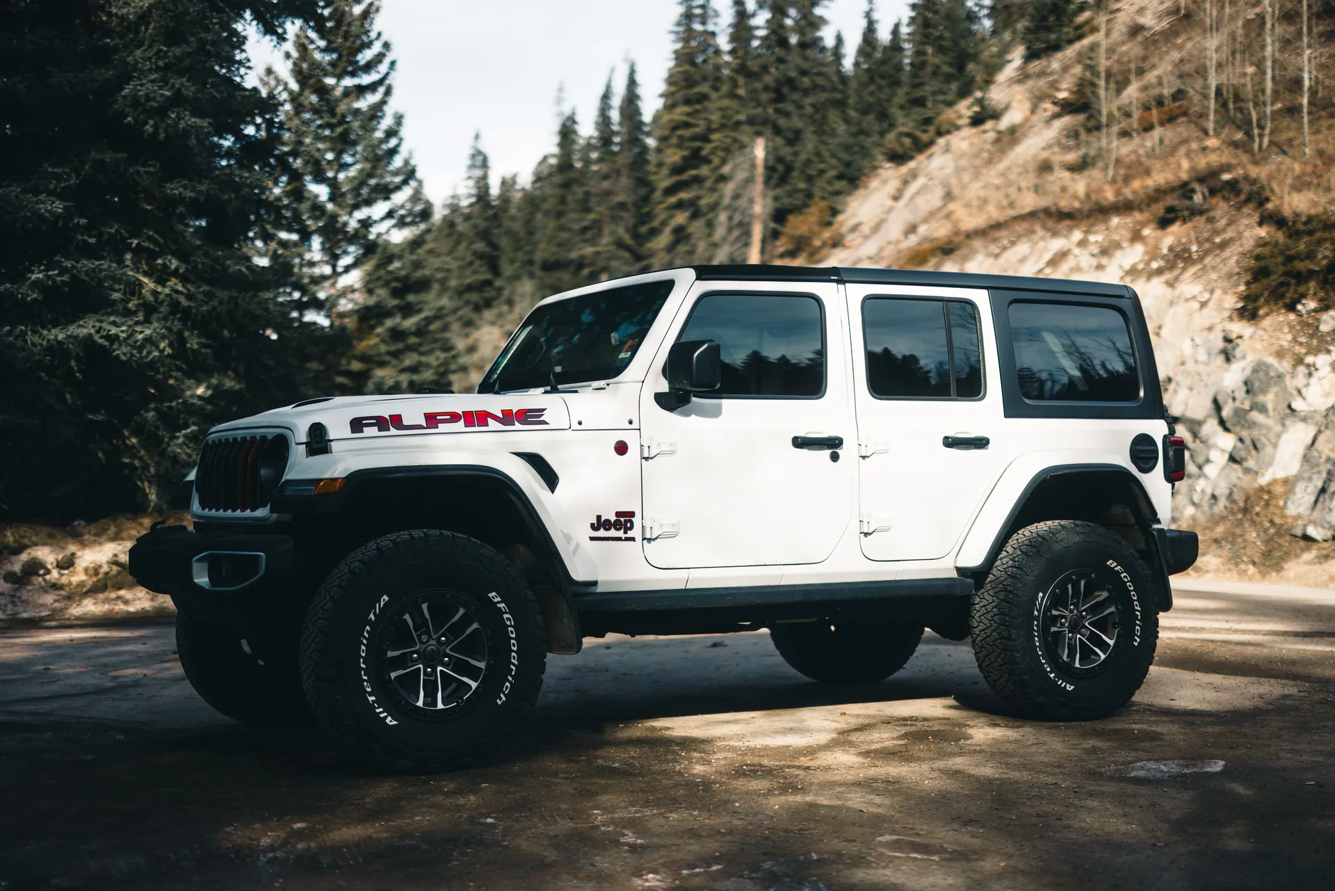 White Jeep Wrangler in Jasper National Park, Alberta, perfect for adventure and exploration.