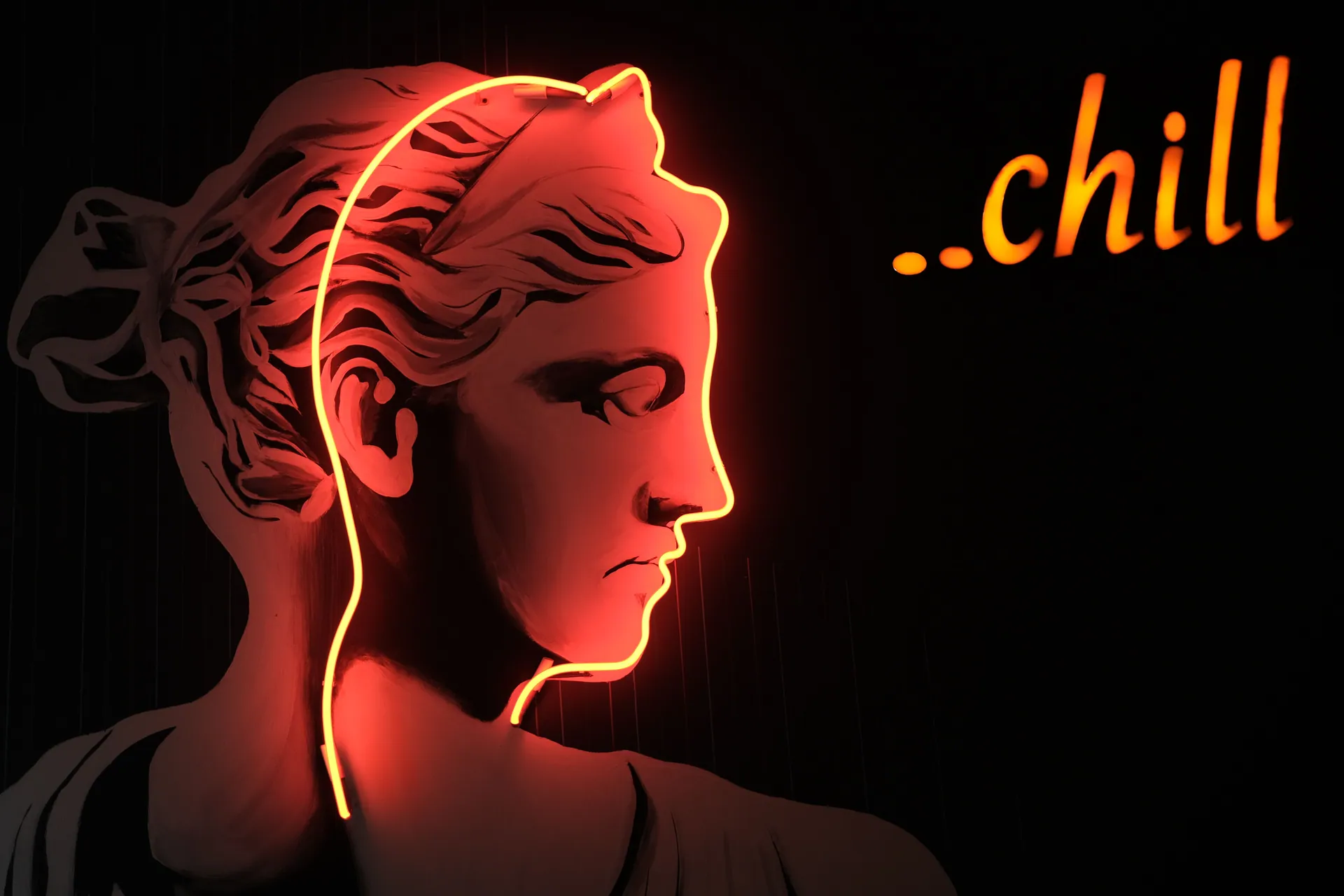 Stylized neon-lit sculpture with the word 'chill' emitting a laid-back vibe.