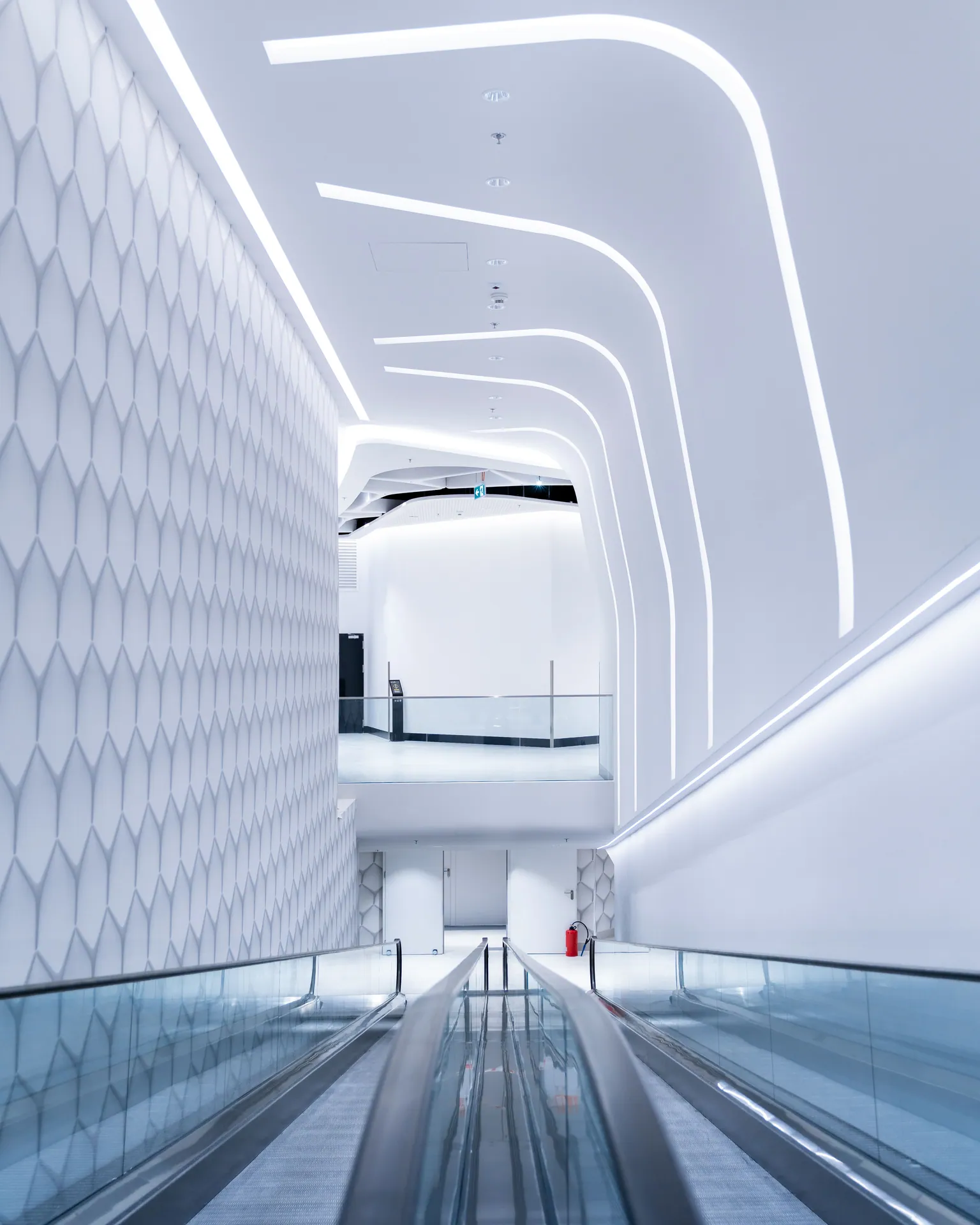 Explore the sleek, minimalist design of the Warsaw Hub with its bright futuristic interior.