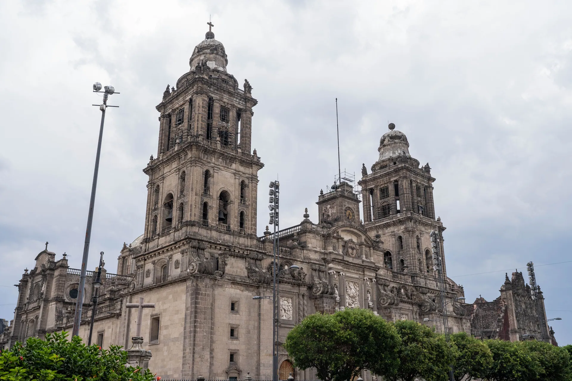 Explore the historical Metropolitan Cathedral in Mexico City against a cloudy backdrop.