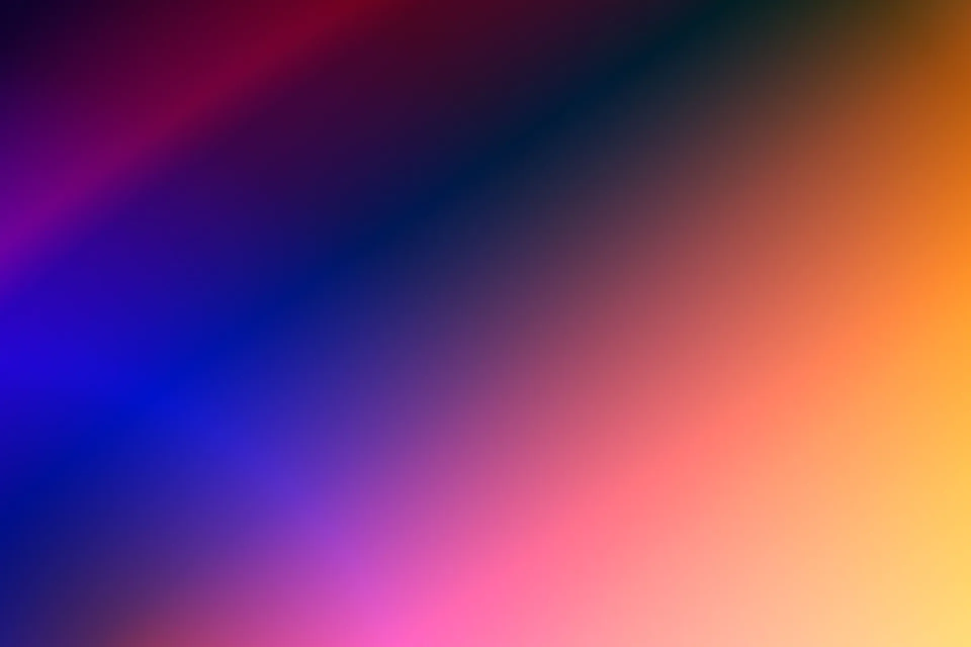 A vivid, colorful gradient blending orange, purple, and blue hues, perfect for digital backgrounds.