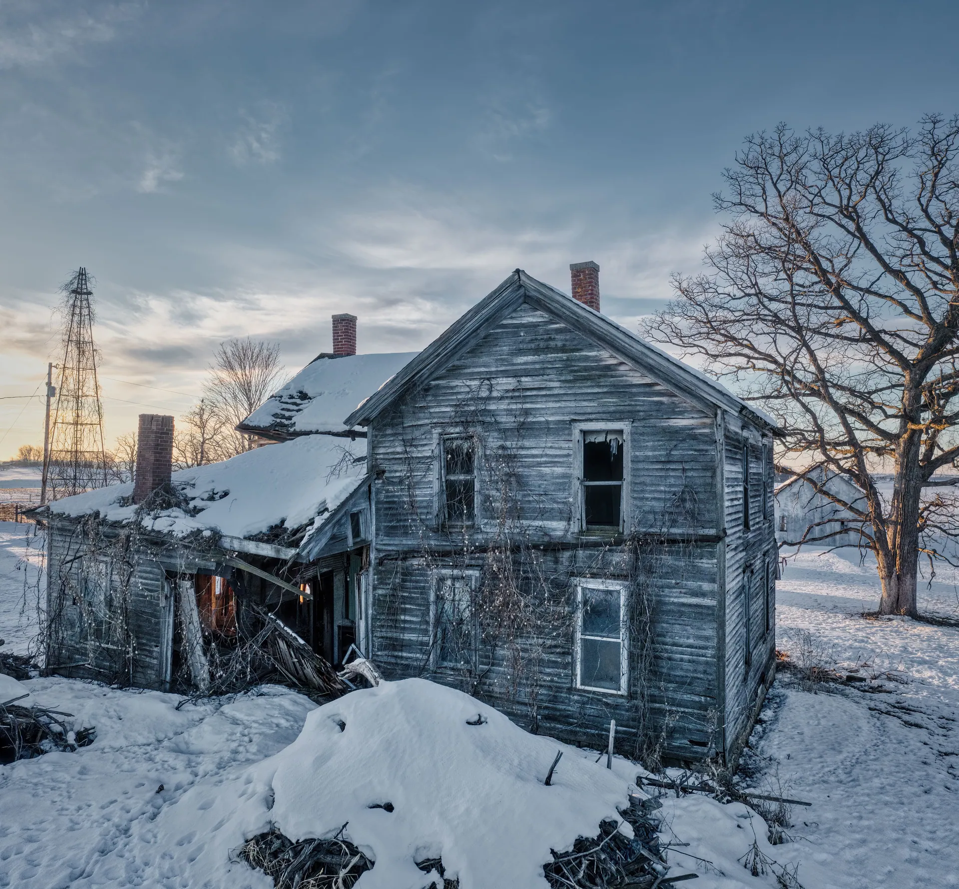 Explore the haunting beauty of an abandoned farmhouse in snowy West Albany, Minnesota.