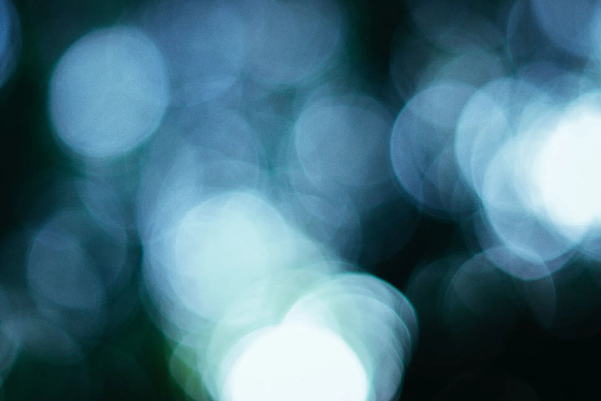 High-quality abstract bokeh light pattern in cool blue tones.