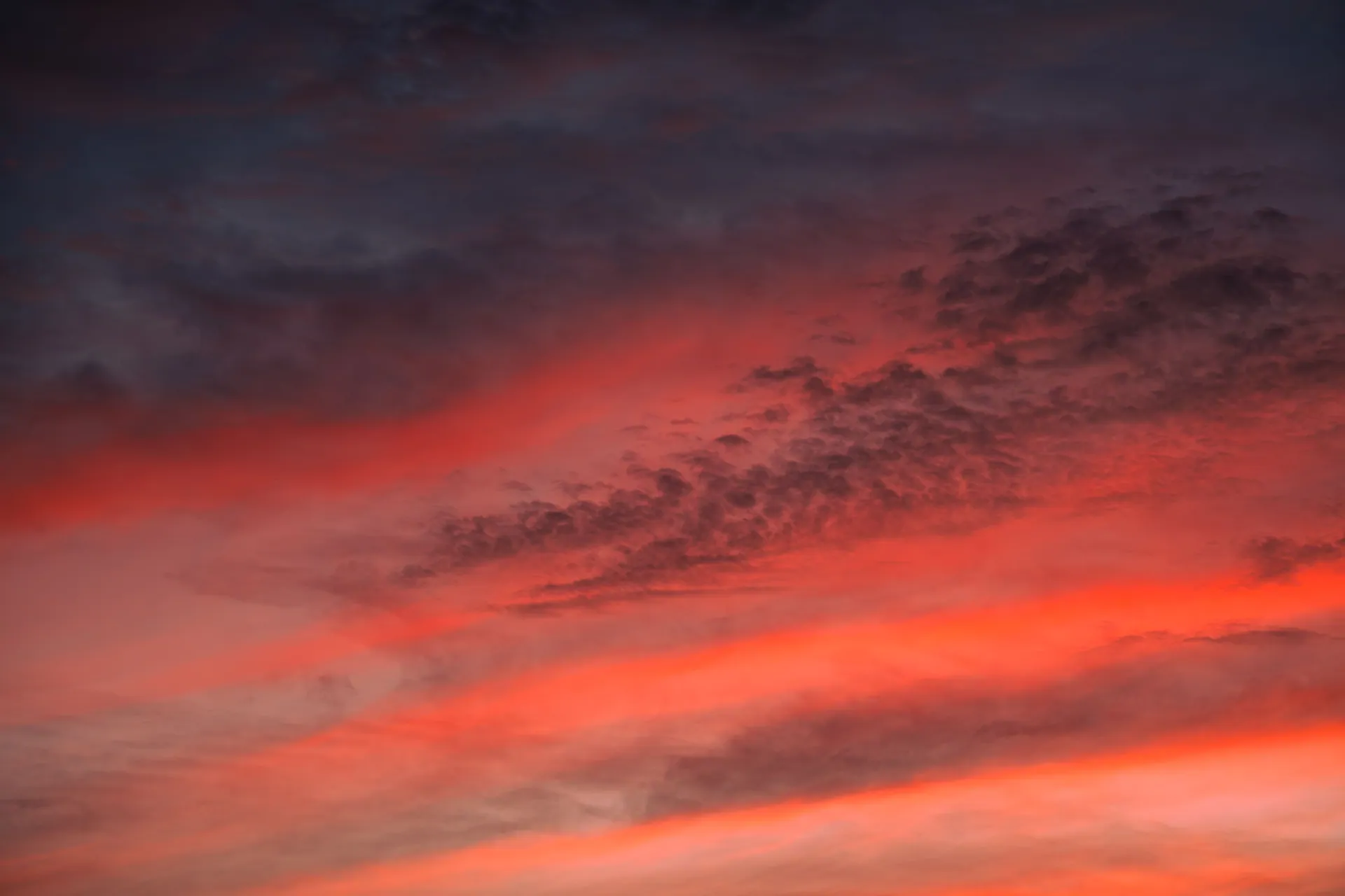 Stunning vibrant sunset sky with dramatic clouds and warm colors.