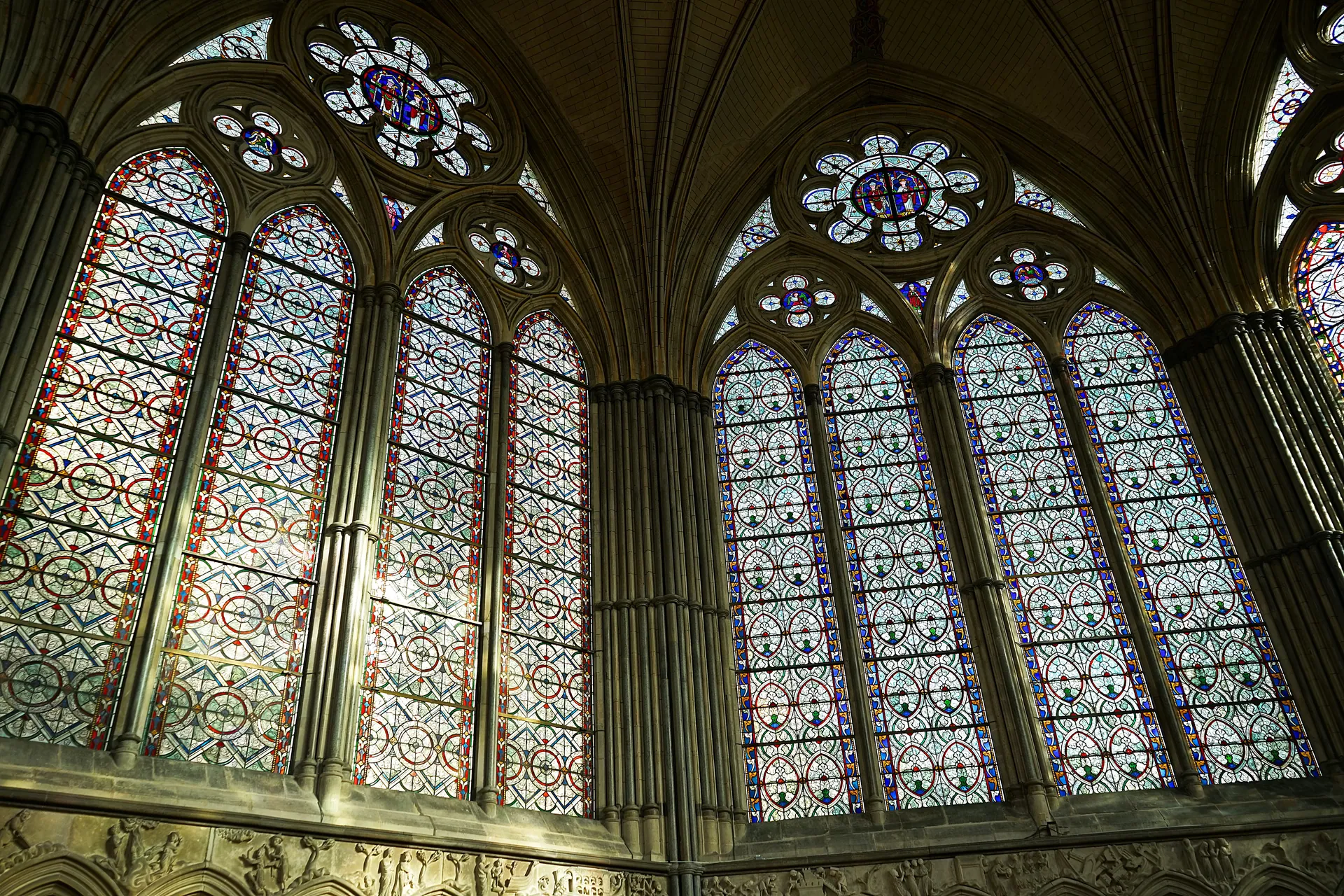 Beautiful stained glass windows in Salisbury Cathedral, England, with intricate patterns.