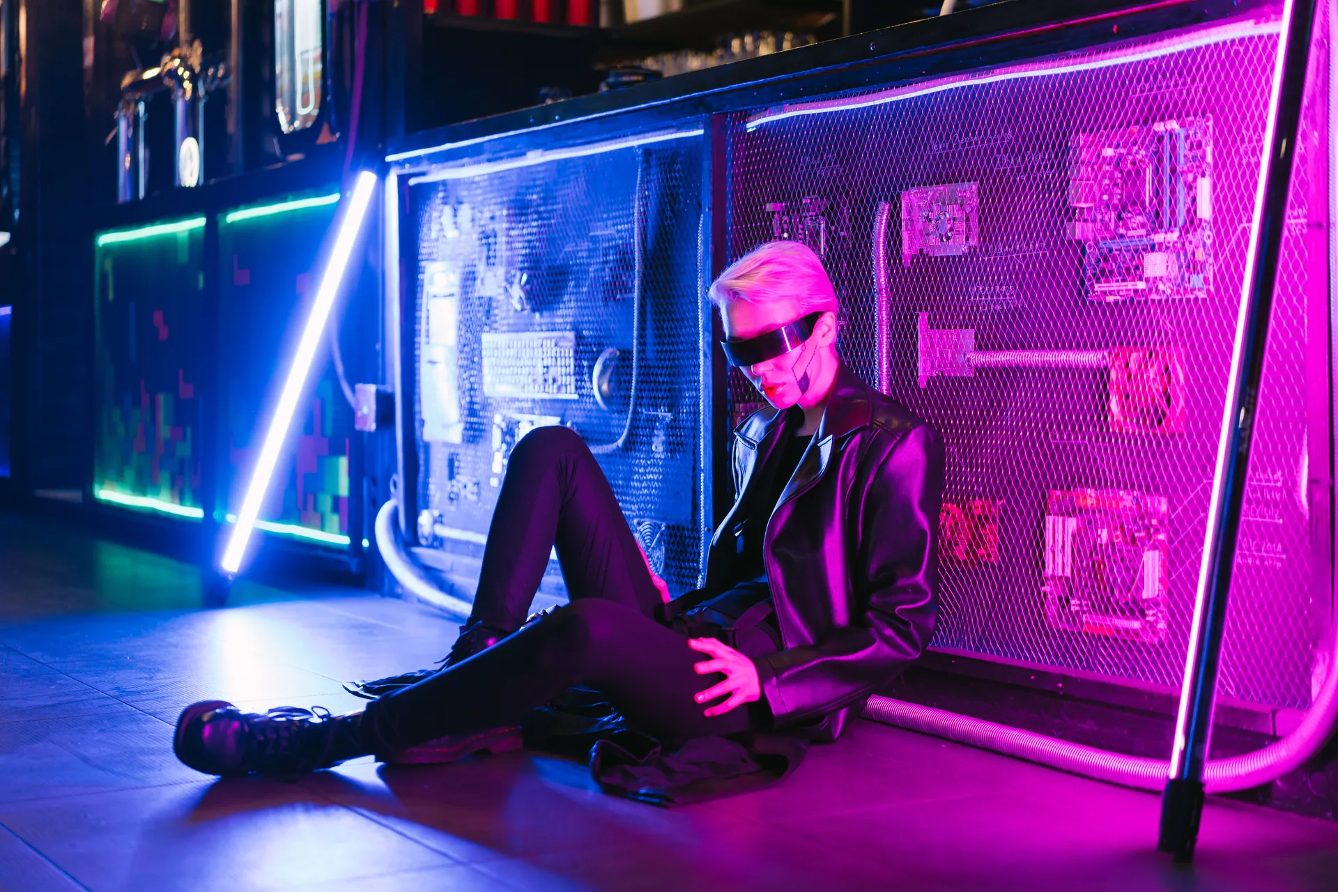 A modern cyberpunk scene featuring a stylish individual in neon lighting, showcasing futuristic fashion.