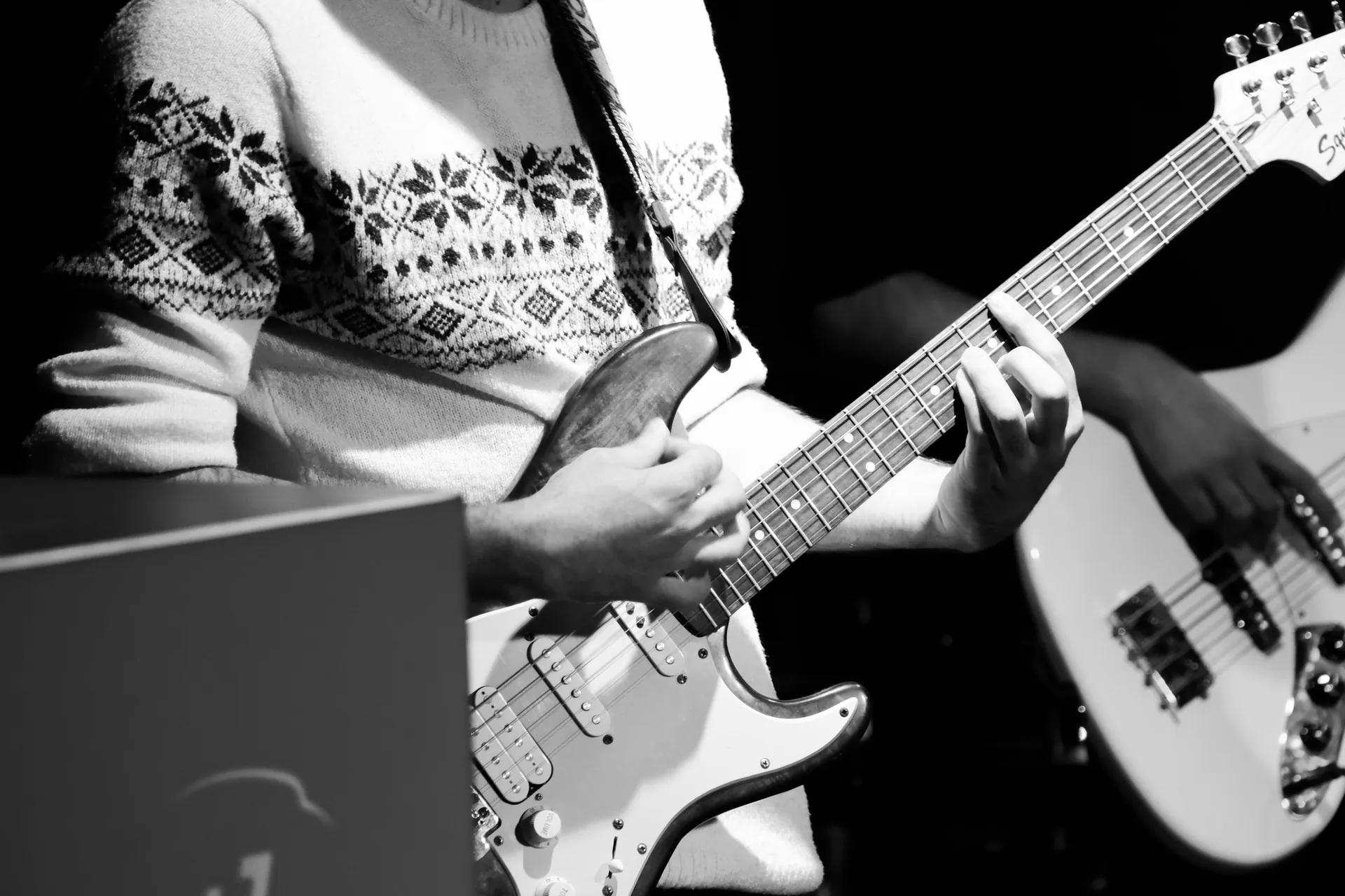 Musician playing electric guitar at a rock concert in Ankara, Türkiye.