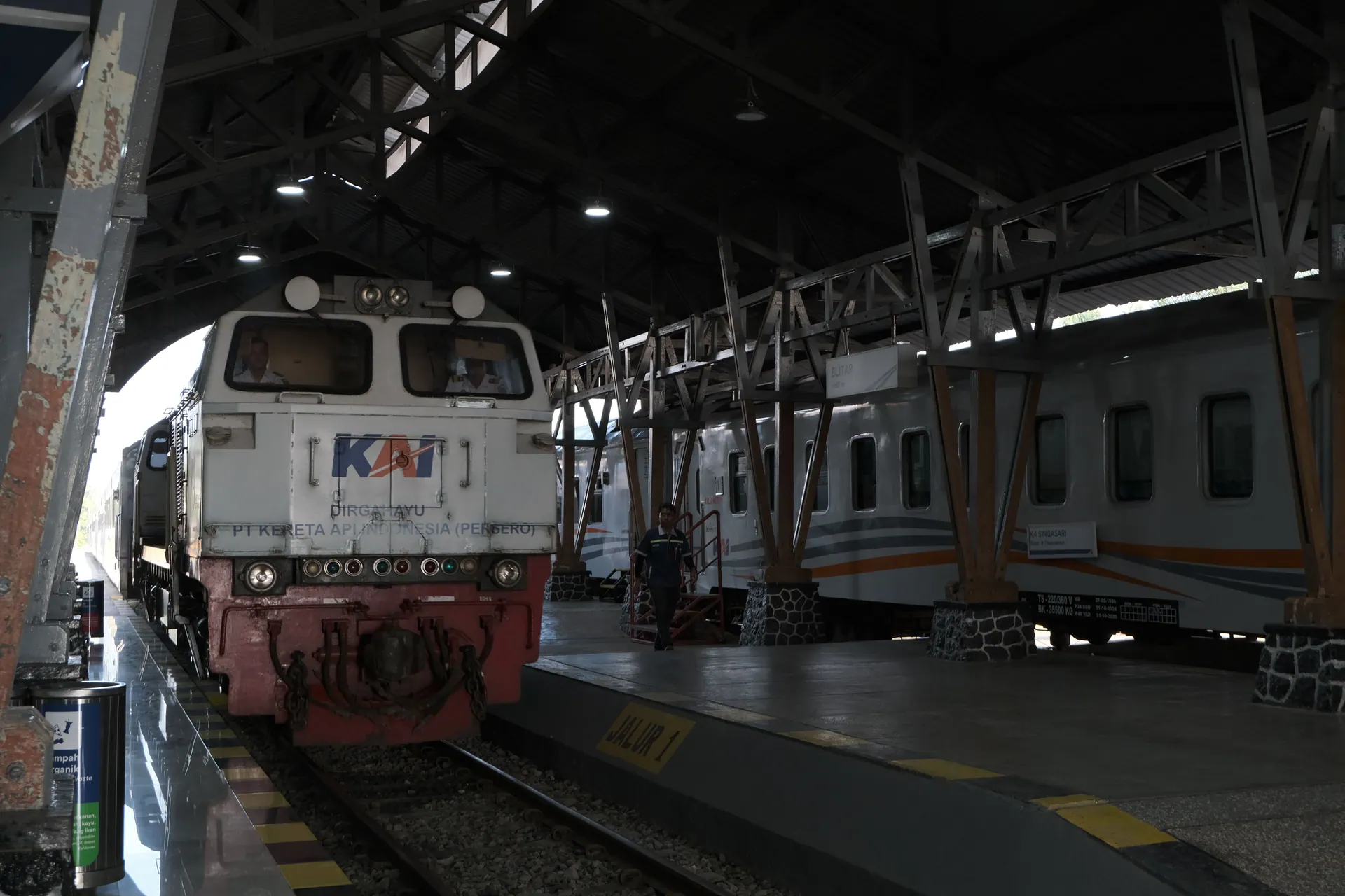 Train at Jakarta station in Indonesia showcasing local rail transport.