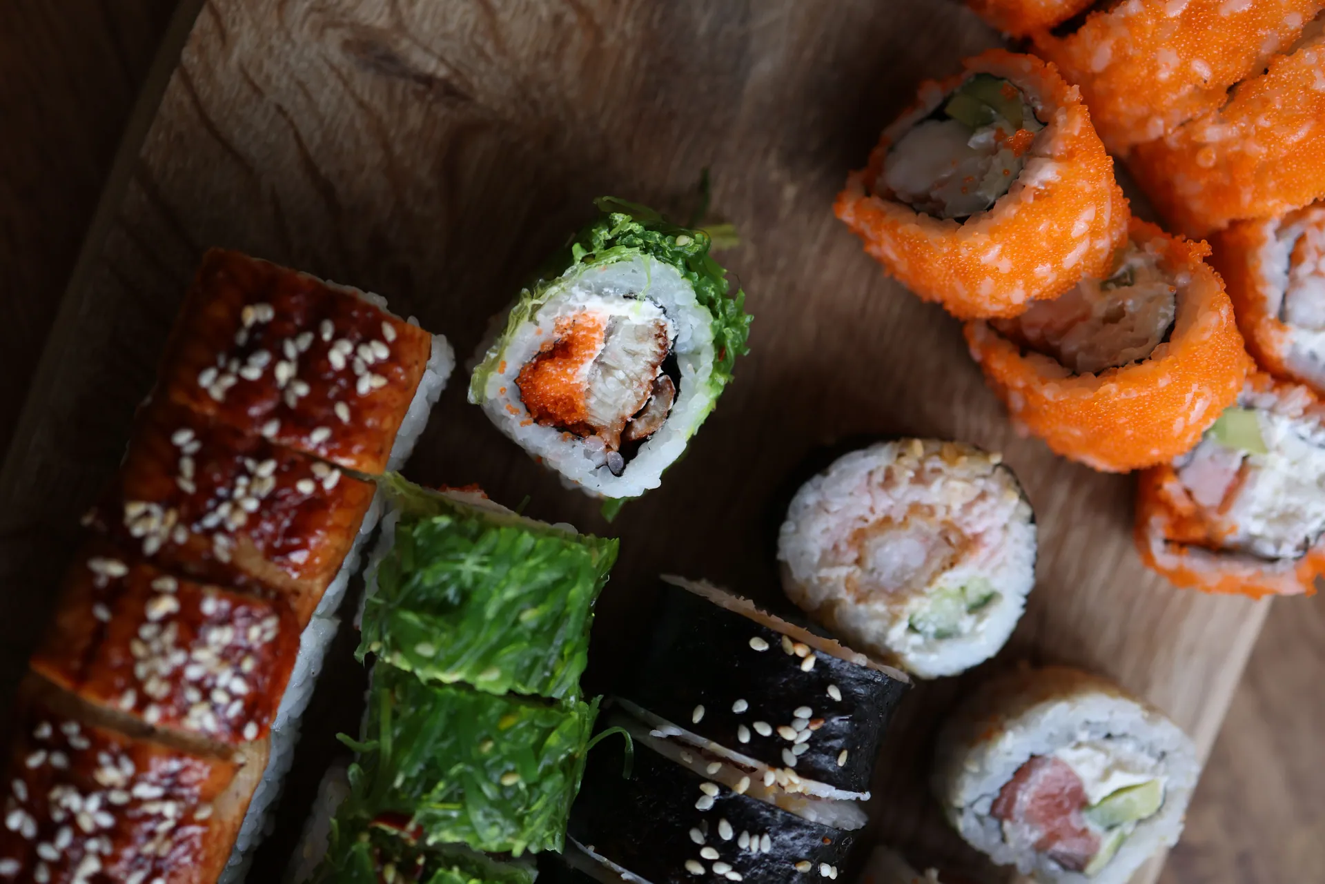 Delicious assortment of sushi rolls featuring various ingredients like shrimp, tuna, and avocado.