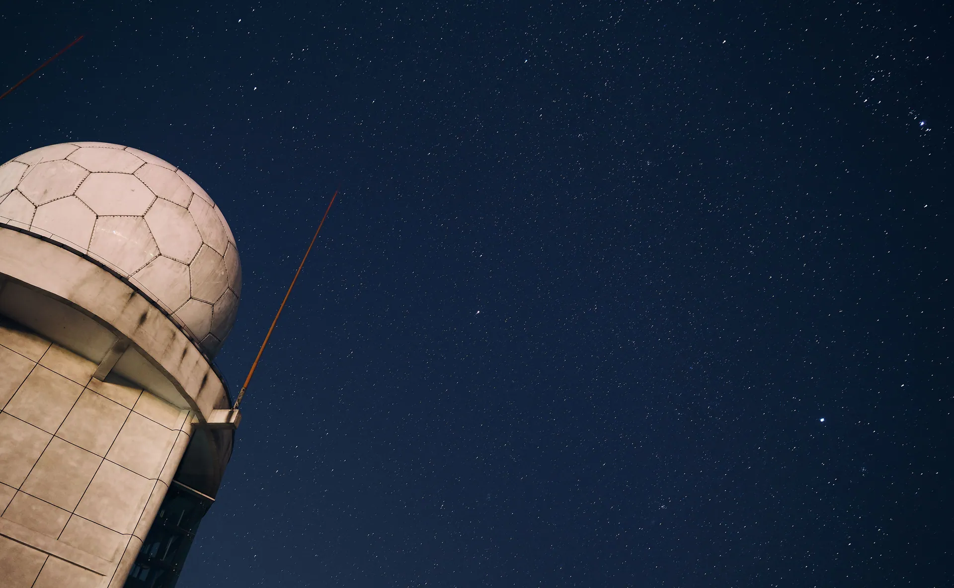 A stunning view of a starry night sky above an observatory dome, capturing the beauty of the cosmos.