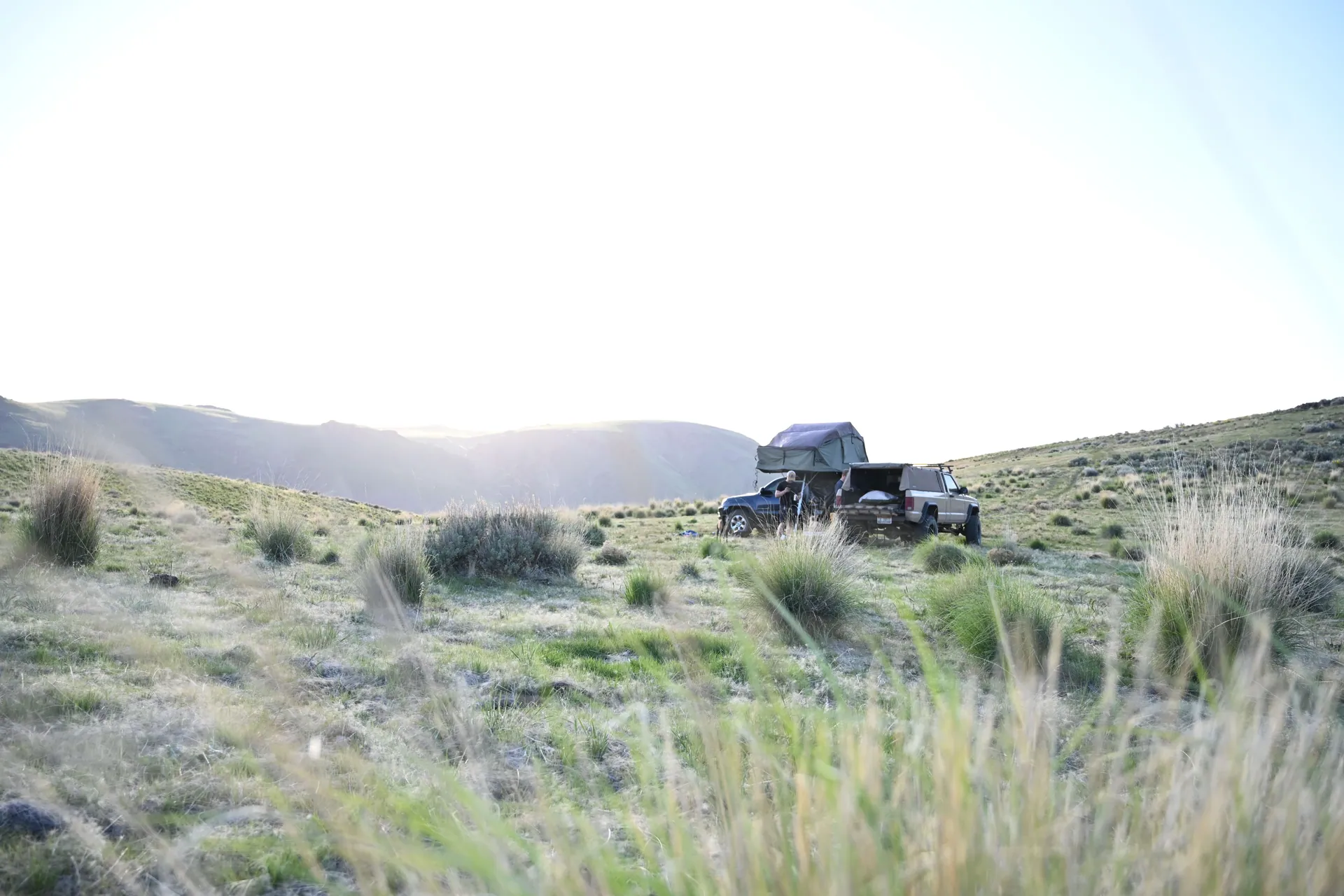 4x4 vehicle camping in remote grassland, perfect for adventure and exploration.