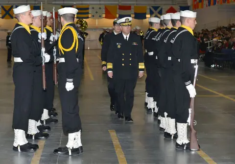 US Navy 120120-N-CM124-189 Vice Adm. James P. Wisecup, Naval Inspector General, inspects a recruit drill platoon at a pass-in-review graduation in