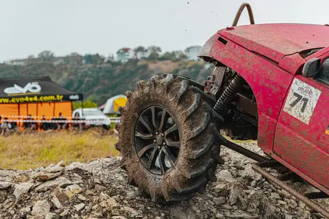 A powerful offroad vehicle conquers rugged terrain in an action-packed outdoor race, showcasing power and adventure.