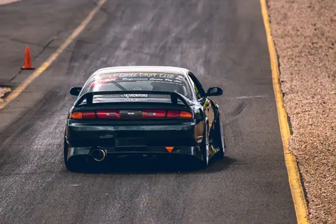 High-speed drift car on a track at Eastern Creek, Australia.