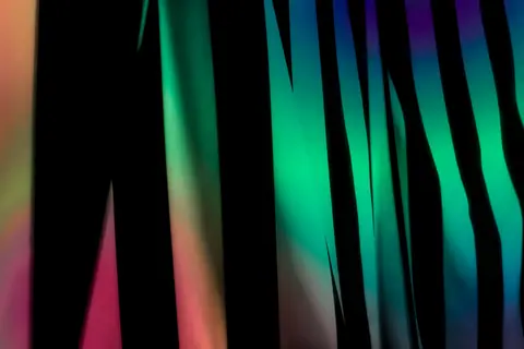 A vibrant and colorful abstract image featuring vivid stripes with a blurred effect.