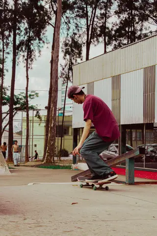 Young man skateboarding on a ramp in an urban outdoor park, emphasizing street culture.