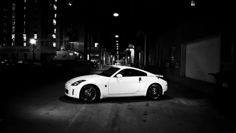 White Nissan 370Z Under City Lights - backiee