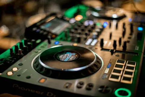 Selective focus of glowing music controller for music mixing and turntables on console