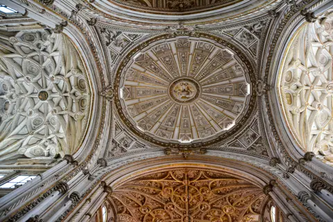 Stunning architectural detail of the Mosque–Cathedral of Córdoba ceiling, showcasing intricate design and craftsmanship.