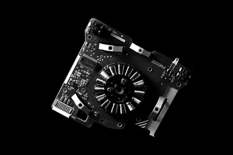 High contrast black and white close-up of a circuit board showcasing electronic components and intricate details.