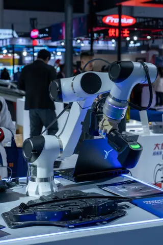Close-up of advanced robotic arms at a technology expo showcasing automation and innovation.