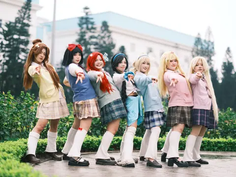 A group of people in vibrant anime cosplay outfits posing together outdoors, exuding fun and creativity.