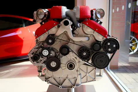Close-up of a powerful Italian car engine, showcasing intricate design and engineering.