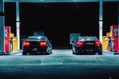 two-black-car-stopped-at-gasoline-station-wallpaper-2736x1824-26287_41-886208325