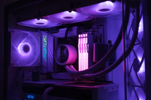 Close-up of a gaming PC showcasing vibrant RGB lighting and cooling system for high performance.