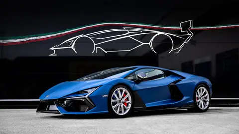Blue sports car in front of abstract automotive art, showcasing sleek design.