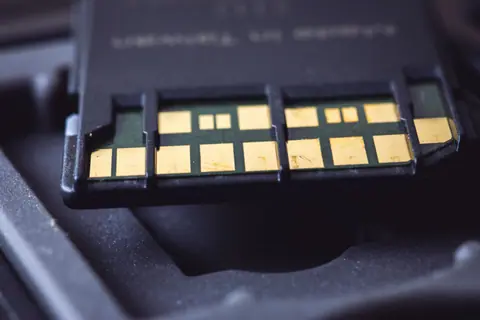 Detailed macro shot of SD card connector pins, highlighting technology and electronics.