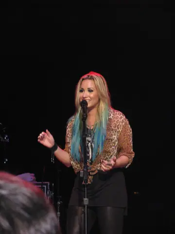 Demi Lovato smiling and singing