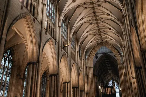 Stunning view of a Gothic cathedral's intricately designed vaulted ceilings and arches.