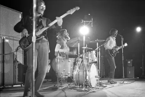 Creedence Clearwater Revival performing on stage at the Forum