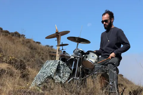 Musician playing drums outdoors in Qazvin Province, Iran.