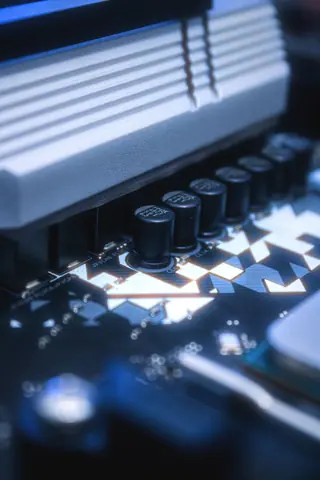 Detailed image of a circuit board featuring capacitors and intricate pathways, ideal for tech-related content.
