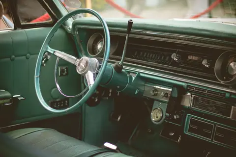 Explore the intricate design of a classic car dashboard with vintage features.