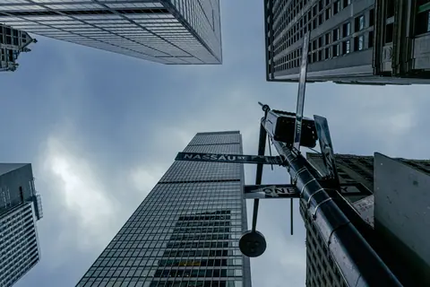 View of skyscrapers from street level at Nassau Street, New York City.