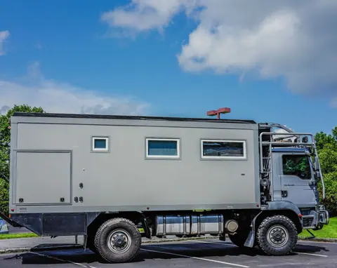 A rugged expedition vehicle parked outdoors, perfect for off-road adventures.