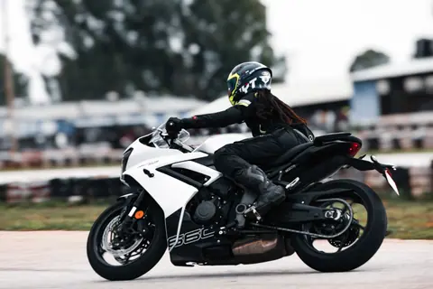 Dynamic shot of a motorcyclist racing on a track in Bengaluru, India, showcasing speed and agility.