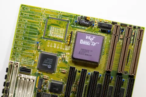 Close-up view of a vintage Intel i486 DX motherboard, highlighting retro technology.