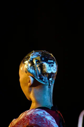 A close-up shot of a humanoid robot's head showcasing advanced technology and robotics.