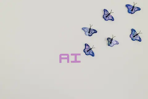 A creative image of butterflies flying over the word 'AI' on a soft pastel background, symbolizing innovation.
